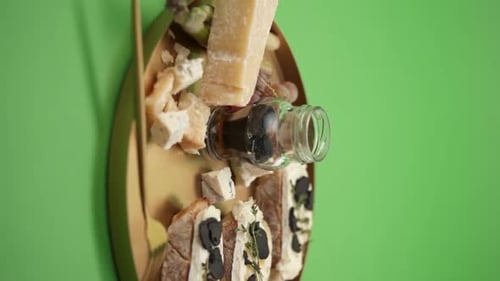 Golden Tray of Cheeses, Bread, and Olives