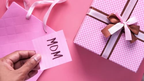 Top View of Mother Day Gift and Flower on Table.