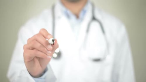 Doctor Writes Word Alcohol With Marker