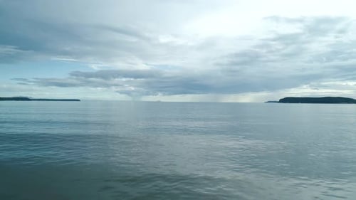 Aerial Drone View Over the Blue Sea on Sunset