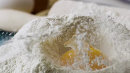 Falling Eggs Into Flour Stock