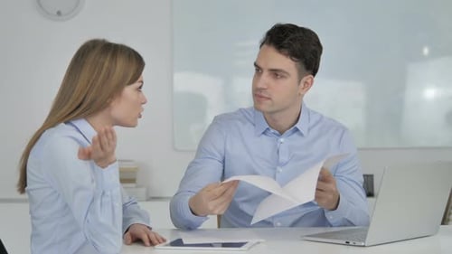 Angry Businessman Discussing Documents with Partner, Business Loss
