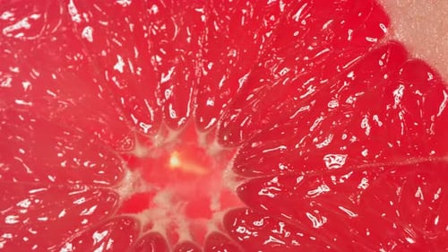 Vibrant Grapefruit Close Up with Dripping Juice