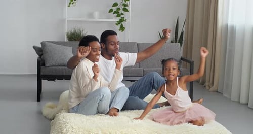 Happy Family Dancing in Living Room