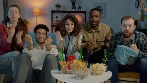 Friends Watching a Sports Game with Disappointment