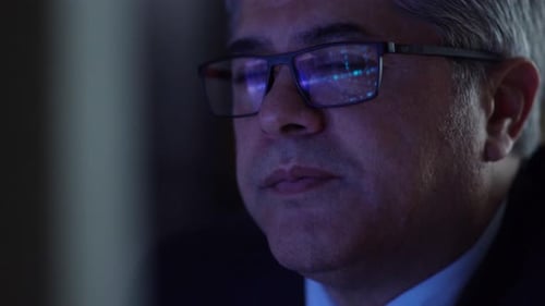 Man Working Late at Night with Computer Screen