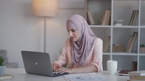 Woman Working at Home Office with Laptop
