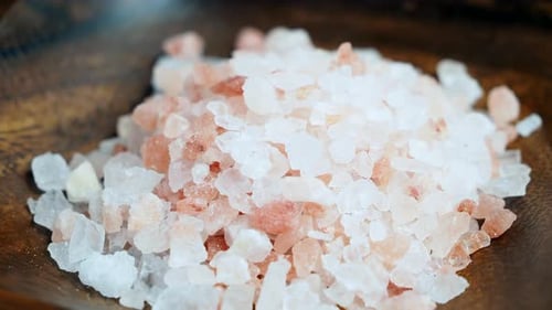 Pile of Himalayan Pink Salt in Wooden Bowl