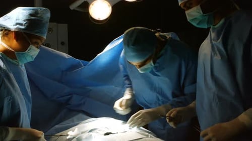 Surgeons Perform Operation in Hospital Operating Room