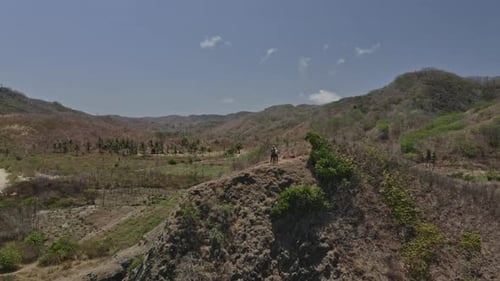 Forest Towards the Beautiful Ocean Waters with Travelers on Top of Cliff
