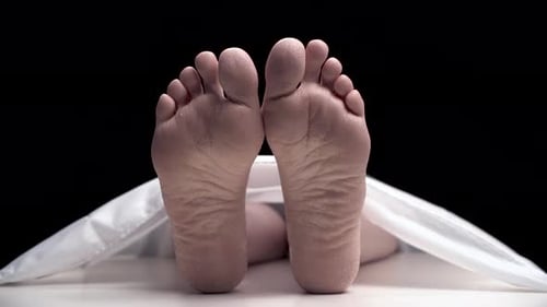 Feet of Deceased Person Lying Under Sheet