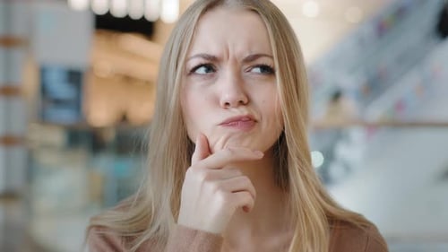 Woman Has an Idea in Shopping Mall