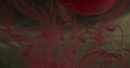 Abstract Red Ink Swirling in Water