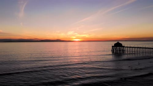 Golden Ocean Sunset Aerial View with Pier