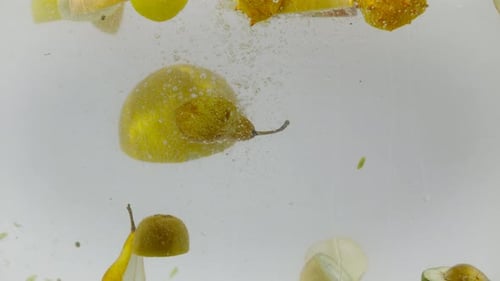 Assorted Yellow Fruits Floating in Water
