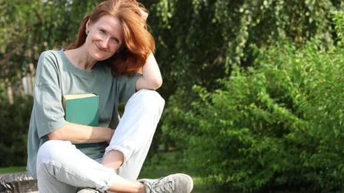 Woman Reading In A Park 9