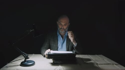 A Serious Writer Prints on the Retro Writing Machine of the Laptop the Text of the Documentary Novel