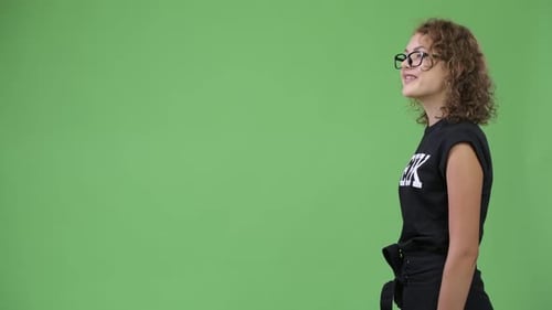 Profile View of Young Happy Beautiful Nerd Woman
