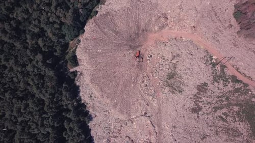 Bird's Eye View of a Garbage Dump Where Machinery Equals Mountains of Household Waste, Ukraine