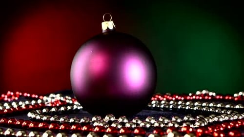 Matte Purple Toy for Christmas or New Year and Beads, Rotation, on Red and Green