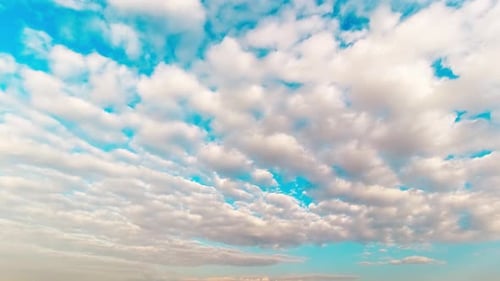 Clouds Moving Slowly Across a Blue Sky