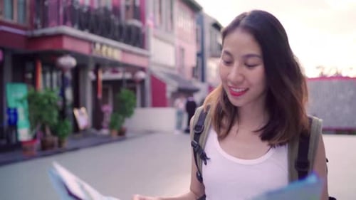 Woman with Backpack Exploring Urban Area