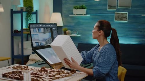 Young Architect Holding Maquette Model in Hand