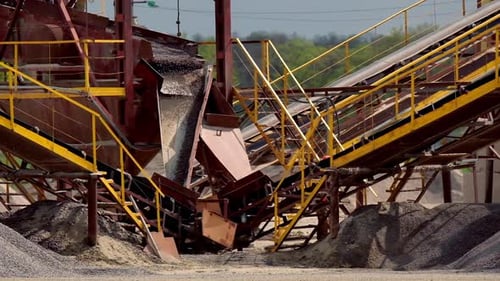 Industrial Machinery Moves Gravel on Conveyor Belts