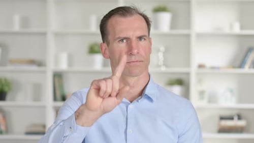 Man Gesturing No with Finger