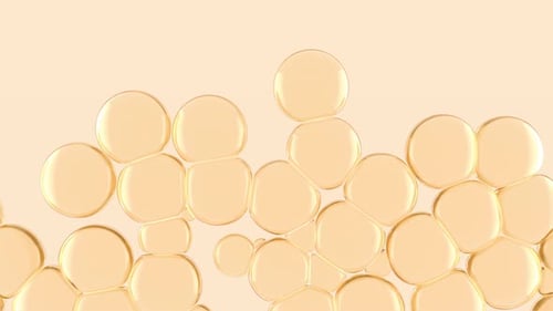 Goldene Ölblasen im Wasser wachsen von unten nach oben und füllen den Raum