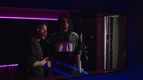Cool Stylish Multiracial Men Rappers Recording Hip Hop Song in Professional Music Studio
