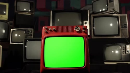 Retro TV with Green Screen Exploding Amid Stacked Old Televisions - 4K