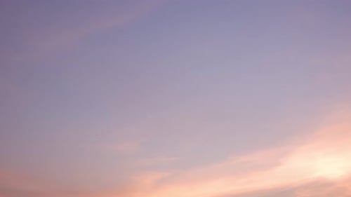 Clouds Moving in Pink and Purple Sunset Sky