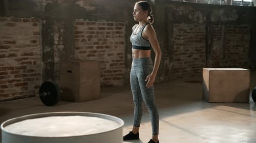 Fitness workout. Sport woman doing squat leg exercise at gym