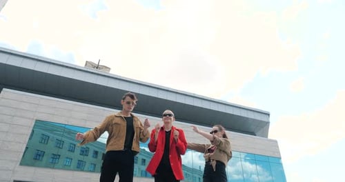 Stylish Friends Dancing Together in Urban Environment