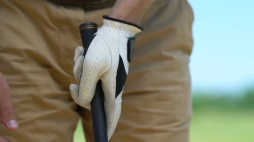 Man Playing Golf, Tightly Holding Club Preparing for Shot, Leisure Activity
