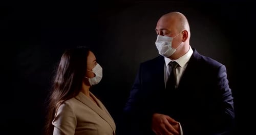 Professionally Dressed People Removing Face Masks