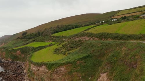 Tracking of Car Driving on Coastal Road Above Rocky Cliffs on Sea Coast