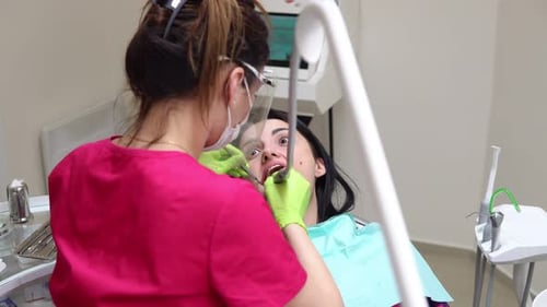 Dentist Works on Patient in Medical Office