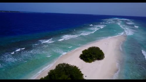 Aerial drone seascape of tranquil coast beach trip by blue ocean with clean sand background of a day