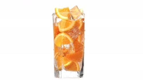 Refreshing Glass with Orange and Ice Cubes