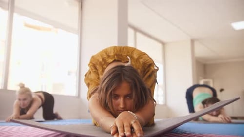 Women Do Yoga Bend the Lower Back and Raising Their Leg Up