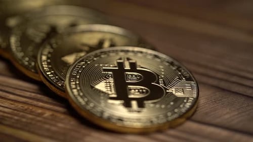 Silver Coins Bitcoins of Cryptocurrency Lie on Dark Table. Close Up