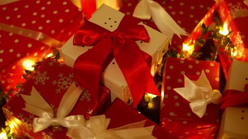 Pile of Christmas Gifts with Fairy Lights