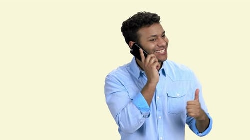 Young Man Talking on Cell Phone Smiling