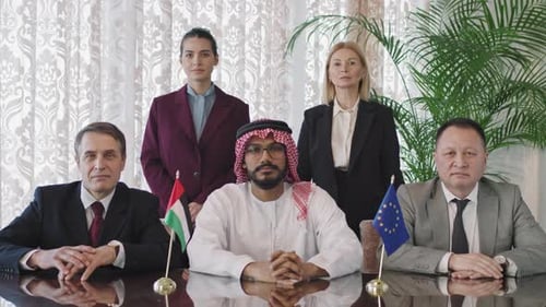 Business Professionals at a Meeting Around Table