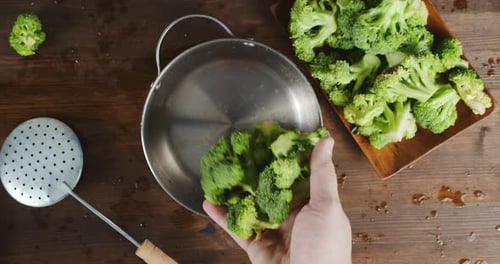 Preparing Fresh Broccoli in Stainless Steel Pot
