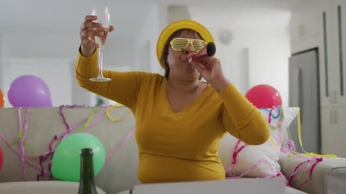 Excited Senior Woman Celebrates with Party Blowout