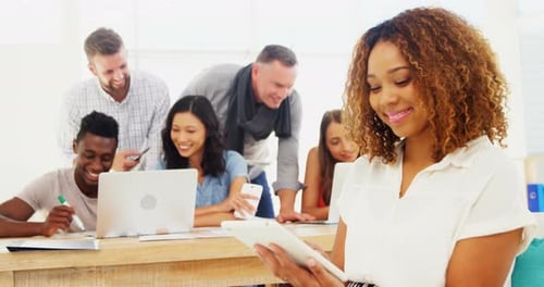 Female executive using digital tablet in the office