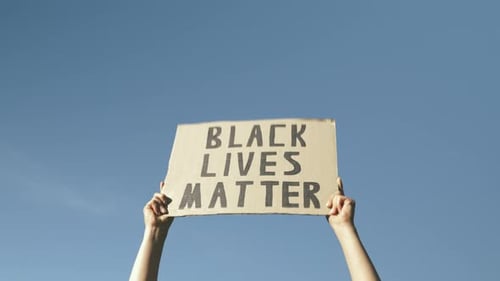 Cardboard Sign Held High Saying Black Lives Matter